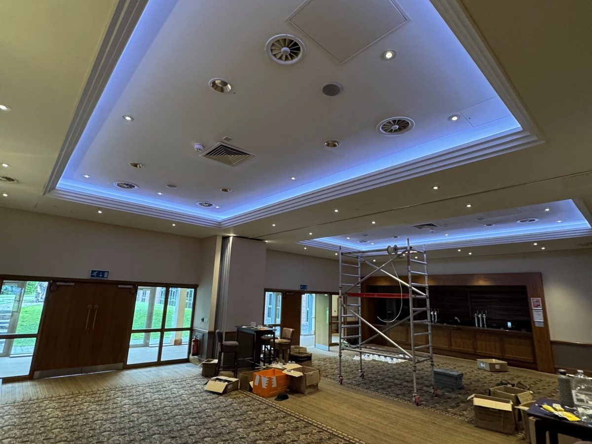 A hotel function room with colour-changing coffer lighting