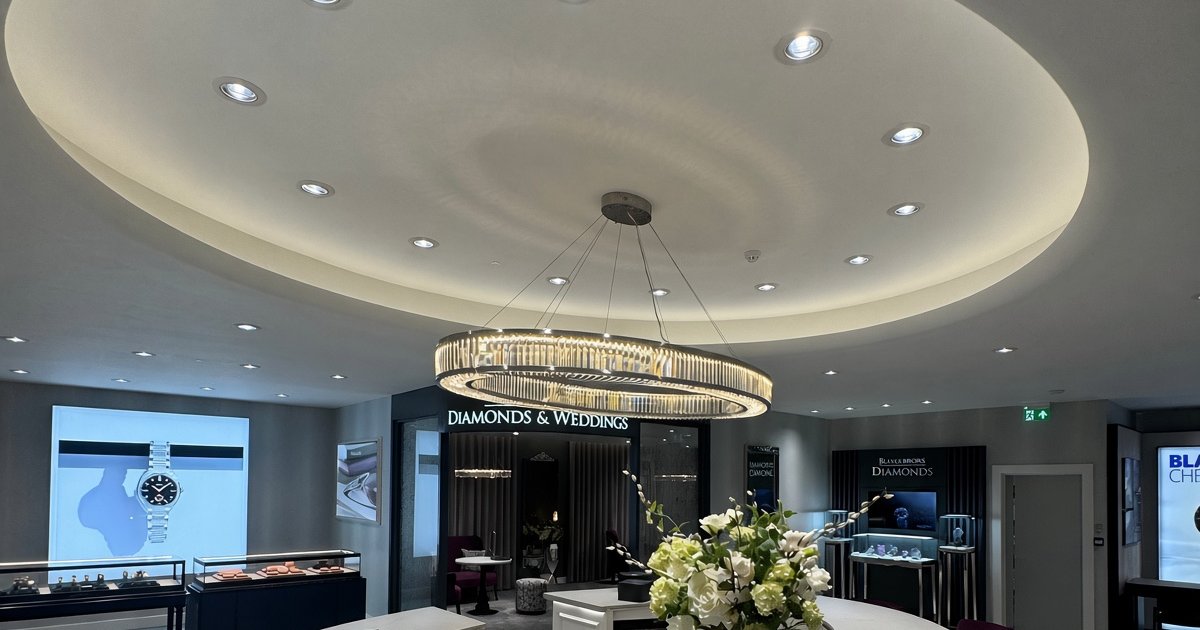 The bespoke two-metre oval crystal pendant ILUX built for Beaverbrooks, Glasgow, hanging over the new counter