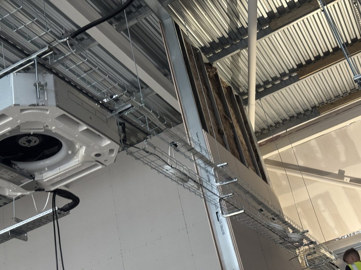 A cassette air conditioning unit installed in a retail unit