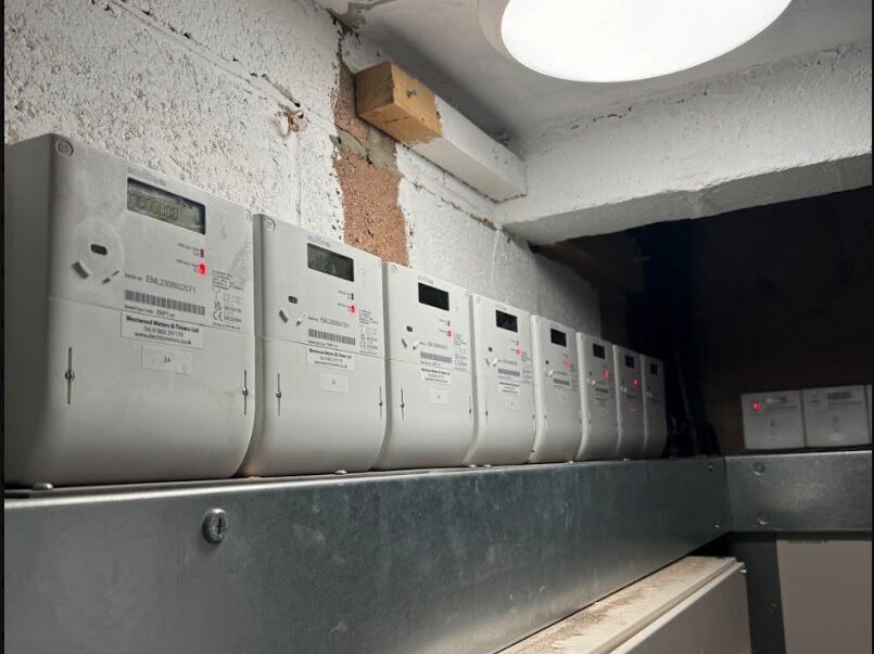 Electricity meters in a site meter cupboard