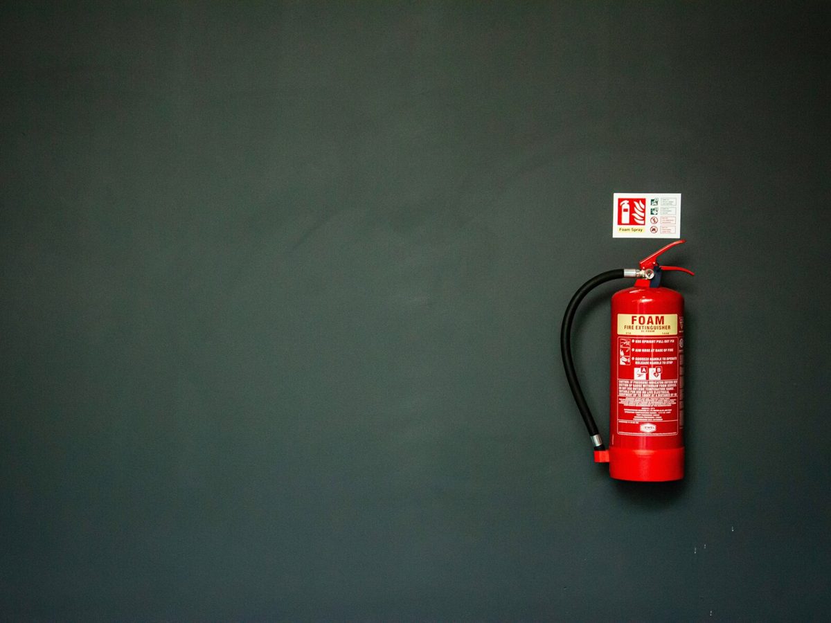 A wall-mounted fire extinguisher