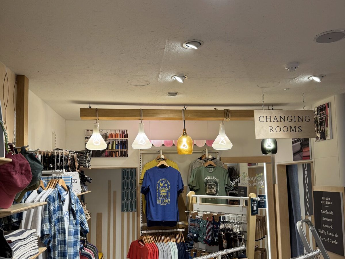 A FatFace store with pendant and spot lighting