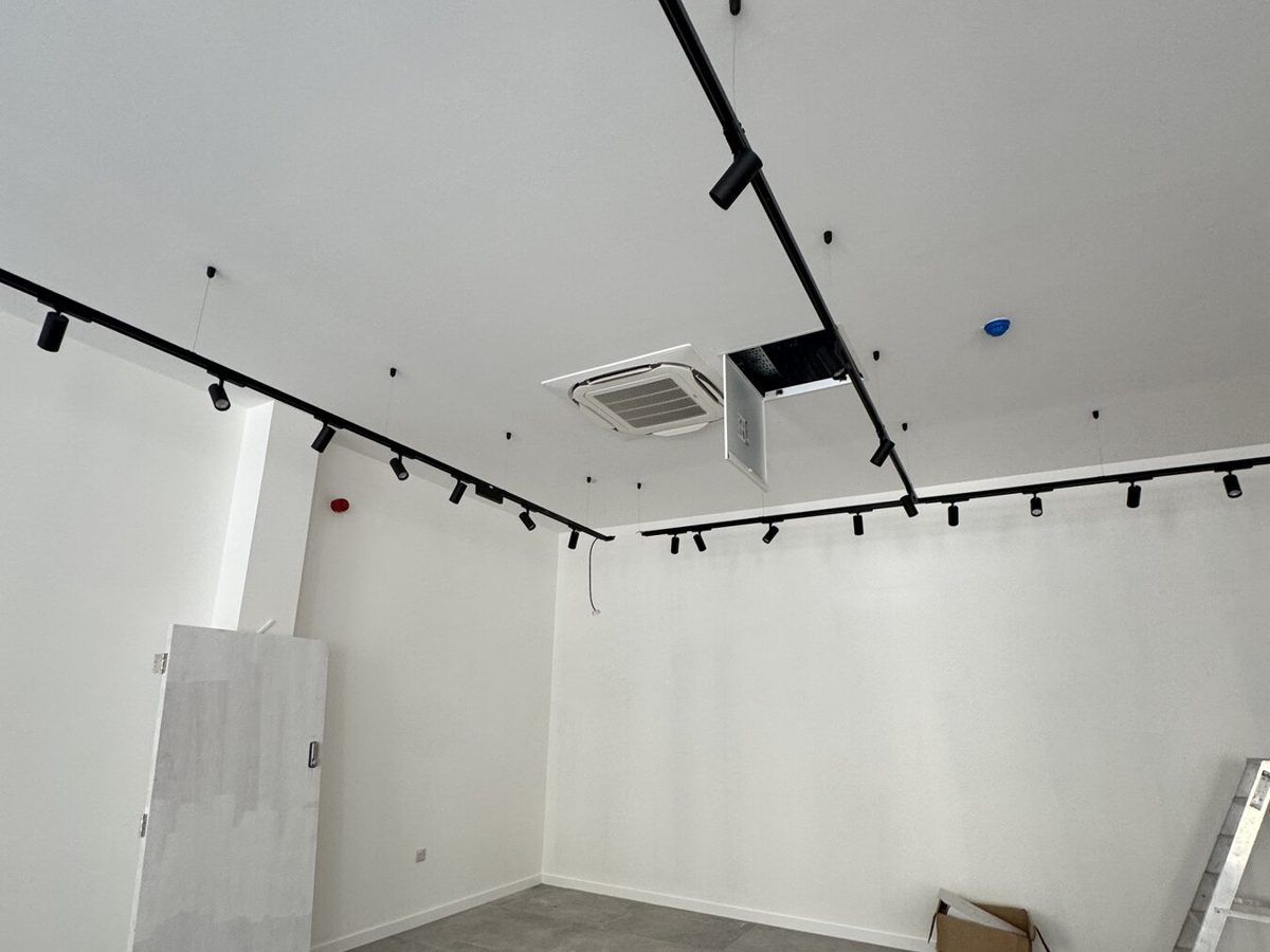 Lighting track installed in an empty retail unit ahead of shopfitting