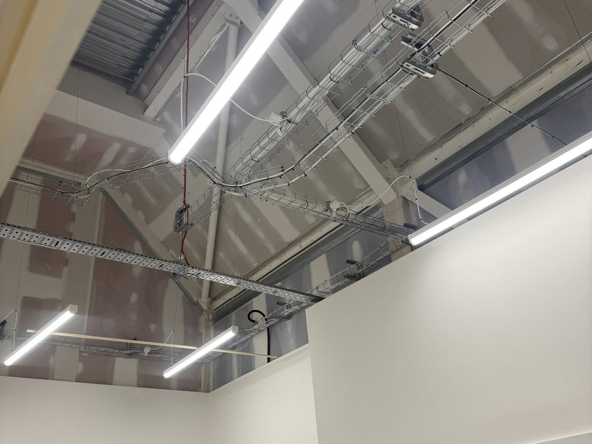 LED battens and an emergency exit sign in a newly fitted unit