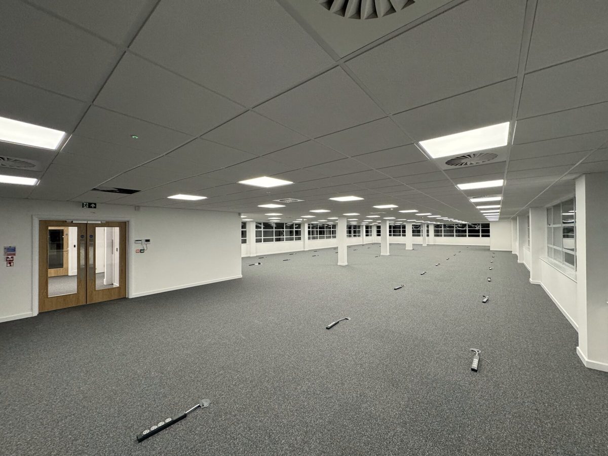 An open-plan office with a new suspended ceiling and LED panels