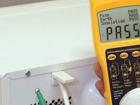 A PAT tester showing a pass result