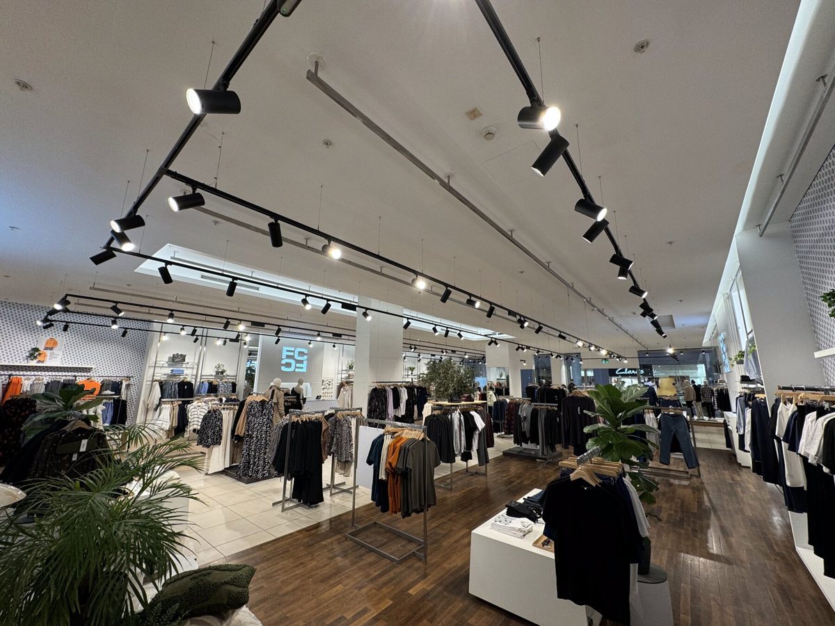 A fashion store lit with track spotlights installed by ILUX
