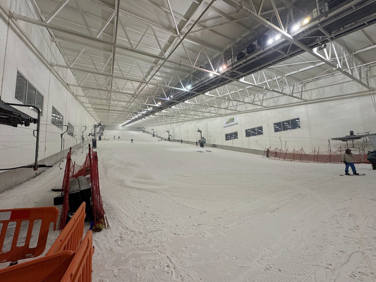 An indoor ski slope lit by high-bay LED fittings