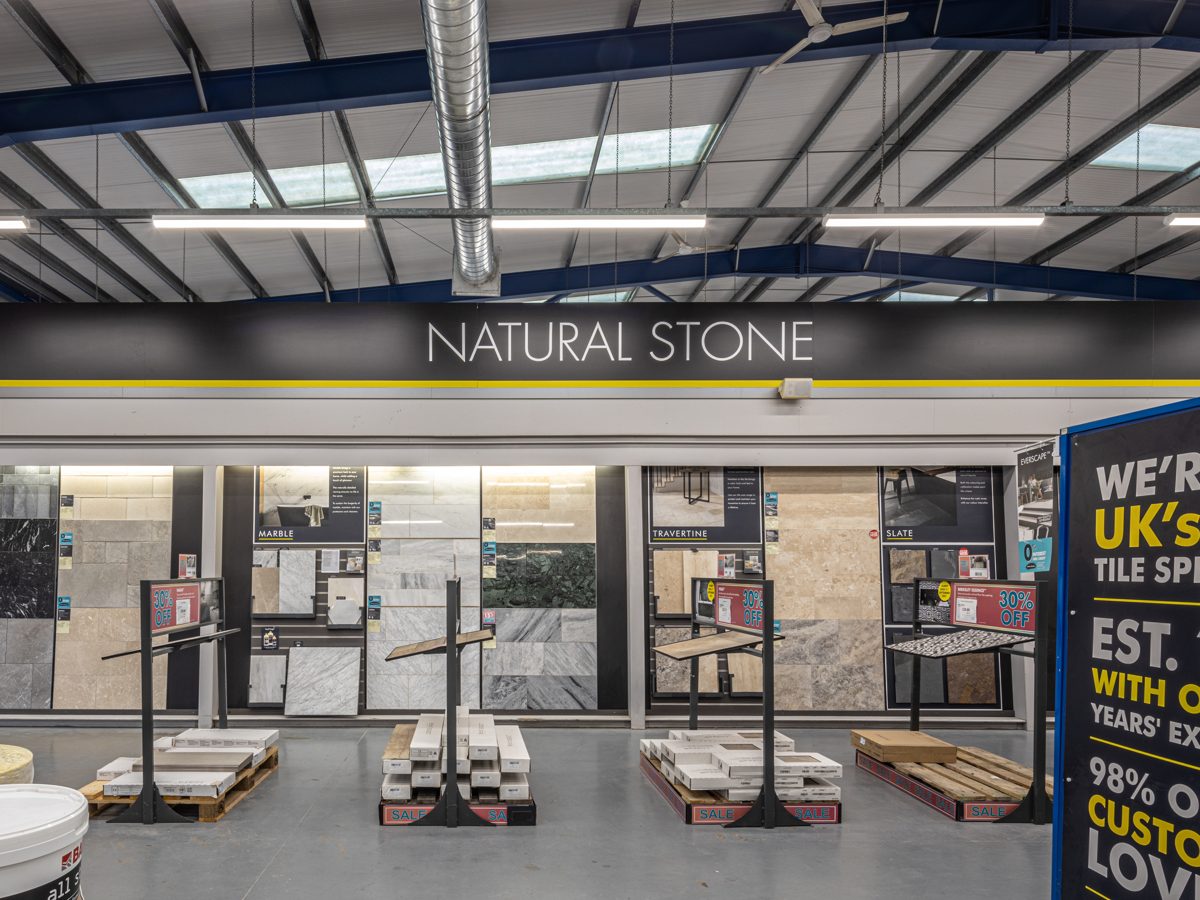 The Natural Stone display bay lit evenly by LED battens above