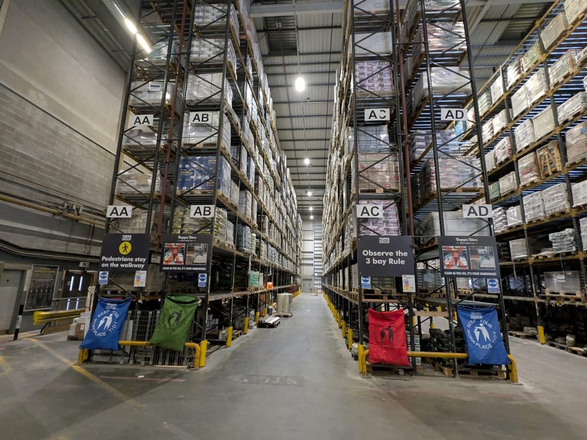 A warehouse racking aisle under LED high-bay lighting